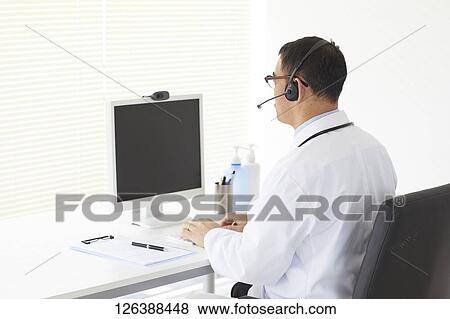 Stock Photo - Japanese doctor in the studio. Fotosearch