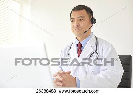 Stock Photo - Japanese doctor in the studio. Fotosearch