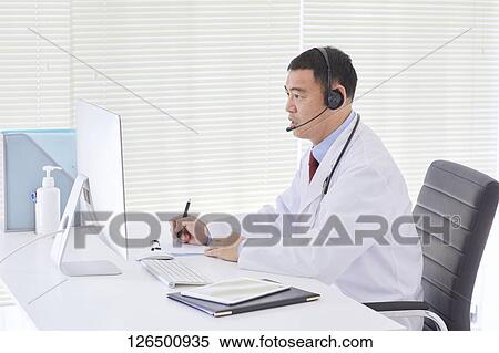 Stock Photography - Japanese doctor in the studio. Fotosearch