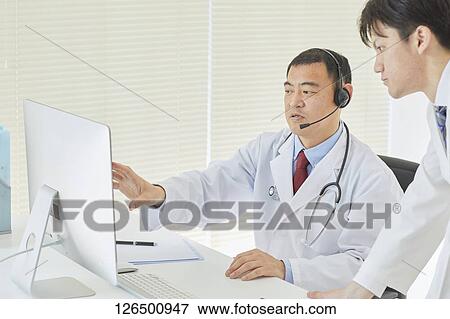 Japanese doctors in the studio View Large Photo Image Stock Photo - Japanese doctors in the studio. Fotosearch