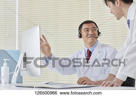 Japanese doctors in the studio View Large Photo Image Stock Photograph - Japanese doctors in the studio. Fotosearch