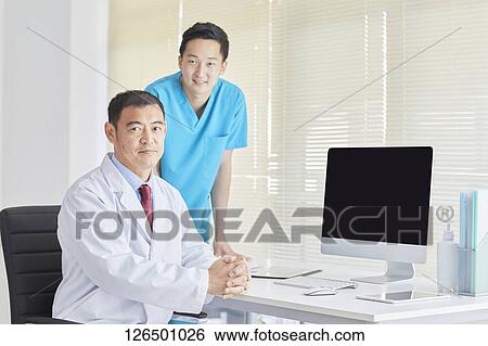 Japanese doctors in the studio View Large Photo Image Stock Photograph - Japanese doctors in the studio. Fotosearch