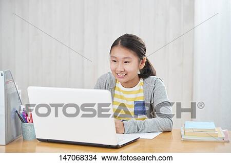 Japanese junior high schoolgirl studying remotely View Large Photo Image Picture - Japanese junior high schoolgirl studying remotely. Fotosearch