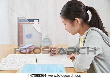 Japanese junior high schoolgirl studying remotely View Large Photo Image Picture - Japanese junior high schoolgirl studying remotely. Fotosearch