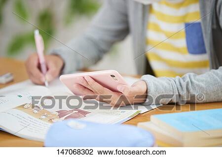 Japanese junior high schoolgirl studying remotely View Large Photo Image Stock Image - Japanese junior high schoolgirl studying remotely. Fotosearch