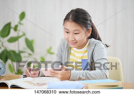 Japanese junior high schoolgirl studying remotely View Large Photo Image Stock Image - Japanese junior high schoolgirl studying remotely. Fotosearch