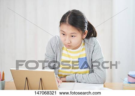 Japanese junior high schoolgirl studying remotely View Large Photo Image Stock Image - Japanese junior high schoolgirl studying remotely. Fotosearch