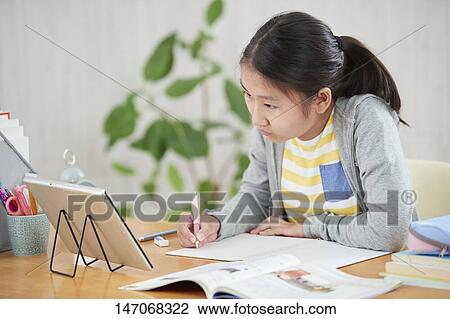 Japanese junior high schoolgirl studying remotely View Large Photo Image Stock Image - Japanese junior high schoolgirl studying remotely. Fotosearch