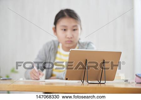 Japanese junior high schoolgirl studying remotely View Large Photo Image Stock Image - Japanese junior high schoolgirl studying remotely. Fotosearch