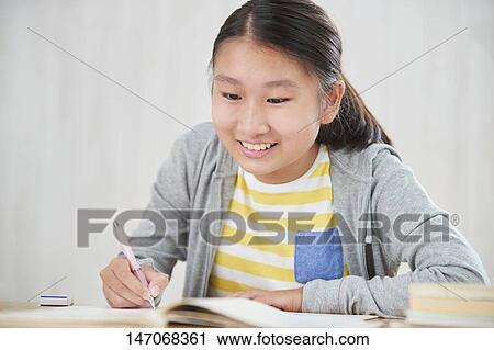 Japanese junior high schoolgirl studying remotely View Large Photo Image Stock Image - Japanese junior high schoolgirl studying remotely. Fotosearch