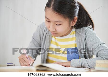 Japanese junior high schoolgirl studying remotely View Large Photo Image Stock Image - Japanese junior high schoolgirl studying remotely. Fotosearch