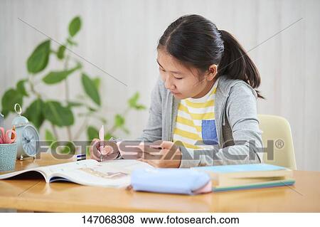 Japanese junior high schoolgirl studying remotely View Large Photo Image Stock Photo - Japanese junior high schoolgirl studying remotely. Fotosearch