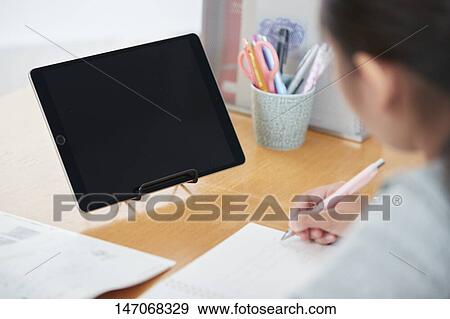 Japanese junior high schoolgirl studying remotely View Large Photo Image Stock Photo - Japanese junior high schoolgirl studying remotely. Fotosearch