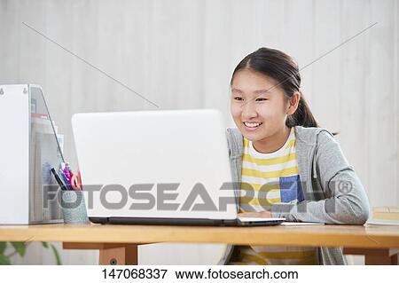 Japanese junior high schoolgirl studying remotely View Large Photo Image Stock Photo - Japanese junior high schoolgirl studying remotely. Fotosearch