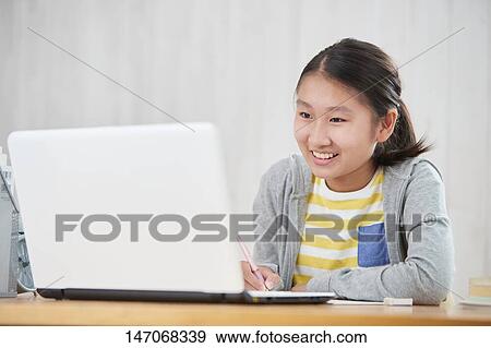 Japanese junior high schoolgirl studying remotely View Large Photo Image Stock Photo - Japanese junior high schoolgirl studying remotely. Fotosearch