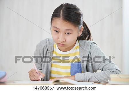 Japanese junior high schoolgirl studying remotely View Large Photo Image Stock Photo - Japanese junior high schoolgirl studying remotely. Fotosearch