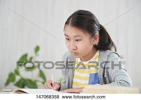 Japanese junior high schoolgirl studying remotely View Large Photo Image Stock Photo - Japanese junior high schoolgirl studying remotely. Fotosearch