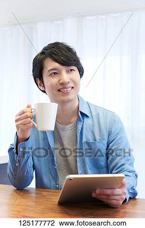 Japanese man at home View Large Photo Image Stock Image - Japanese man at home. Fotosearch