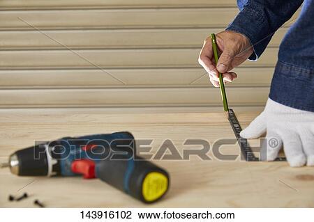 Japanese man doing DIY View Large Photo Image Stock Image - Japanese man doing DIY. Fotosearch
