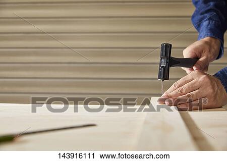 Japanese man doing DIY View Large Photo Image Stock Image - Japanese man doing DIY. Fotosearch