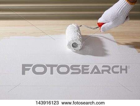 Stock Image - Japanese man doing DIY. Fotosearch