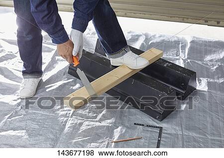 Japanese man doing DIY View Large Photo Image Stock Photo - Japanese man doing DIY. Fotosearch