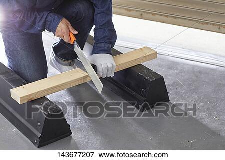 Japanese man doing DIY View Large Photo Image Stock Photo - Japanese man doing DIY. Fotosearch