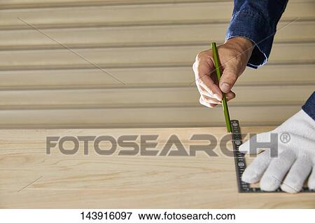 Japanese man doing DIY View Large Photo Image Stock Photo - Japanese man doing DIY. Fotosearch
