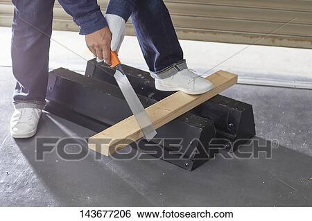 Japanese man doing DIY View Large Photo Image Stock Photograph - Japanese man doing DIY. Fotosearch
