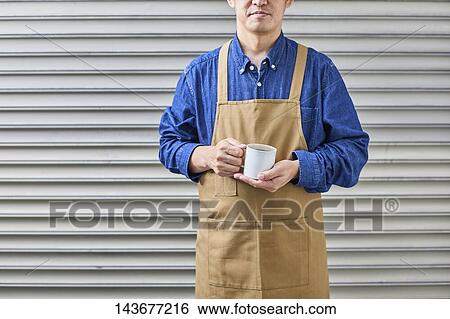 Stock Photograph - Japanese man doing DIY. Fotosearch
