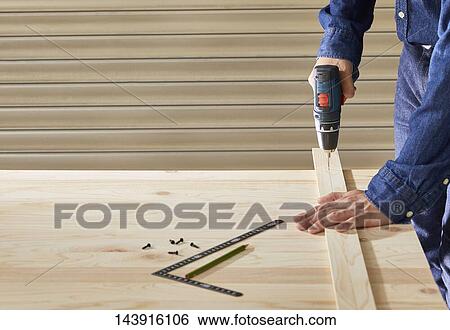 Japanese man doing DIY View Large Photo Image Stock Photograph - Japanese man doing DIY. Fotosearch