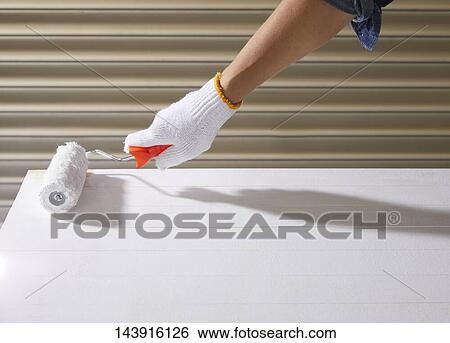 Stock Photograph - Japanese man doing DIY. Fotosearch