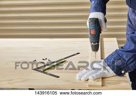 Japanese man doing DIY View Large Photo Image Stock Photography - Japanese man doing DIY. Fotosearch