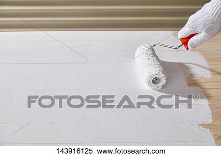 Stock Photography - Japanese man doing DIY. Fotosearch