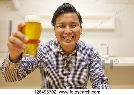Japanese man drinking at home remote drinking View Large Photo Image Stock Image - Japanese man drinking at home remote drinking. Fotosearch