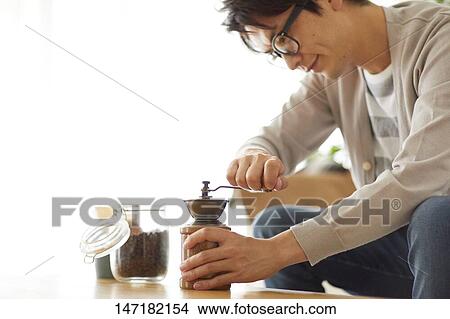 Japanese man making coffee at home View Large Photo Image Picture - Japanese man making coffee at home. Fotosearch