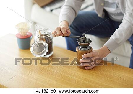 Japanese man making coffee at home View Large Photo Image Stock Image - Japanese man making coffee at home. Fotosearch