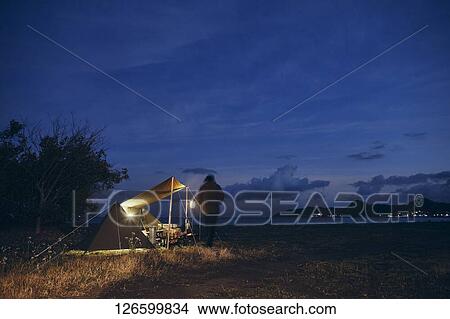 Japanese man solo camping View Large Photo Image Picture - Japanese man solo camping. Fotosearch