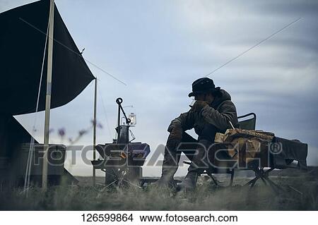 Japanese man solo camping View Large Photo Image Picture - Japanese man solo camping. Fotosearch