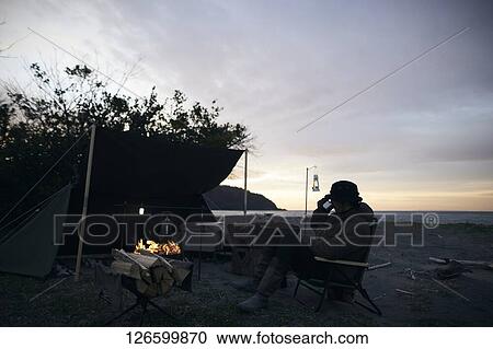Japanese man solo camping View Large Photo Image Stock Image - Japanese man solo camping. Fotosearch