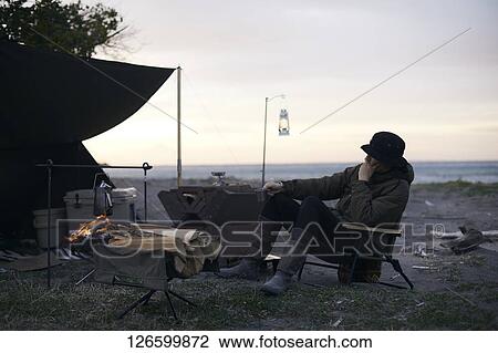 Japanese man solo camping View Large Photo Image Stock Image - Japanese man solo camping. Fotosearch