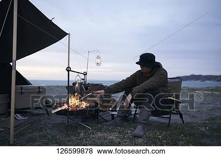 Japanese man solo camping View Large Photo Image Stock Photo - Japanese man solo camping. Fotosearch