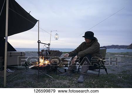 Japanese man solo camping View Large Photo Image Stock Photo - Japanese man solo camping. Fotosearch