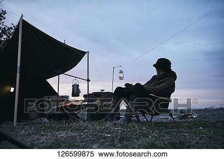 Japanese man solo camping View Large Photo Image Stock Photography - Japanese man solo camping. Fotosearch