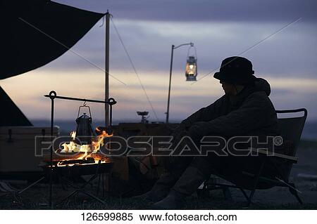 Stock Photography - Japanese man solo camping. Fotosearch