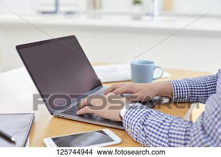 Japanese man working from home View Large Photo Image Picture - Japanese man working from home. Fotosearch