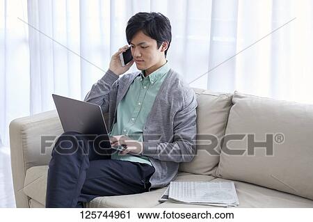 Japanese man working from home View Large Photo Image Stock Image - Japanese man working from home. Fotosearch