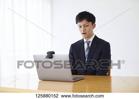 Japanese man working from home View Large Photo Image Stock Image - Japanese man working from home. Fotosearch