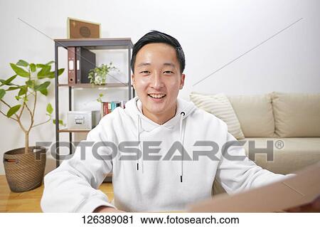 Japanese man working from home View Large Photo Image Stock Image - Japanese man working from home. Fotosearch