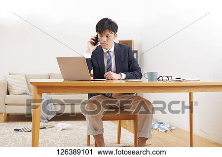 Japanese man working from home View Large Photo Image Stock Image - Japanese man working from home. Fotosearch